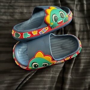 Unisex Dino slides blue with multi colors size 7.5 toddler